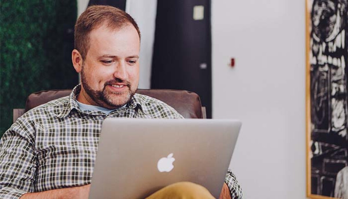 Happy man has a meeting on Gotomeeting