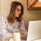 Woman comparing bundled broadband and power deals online